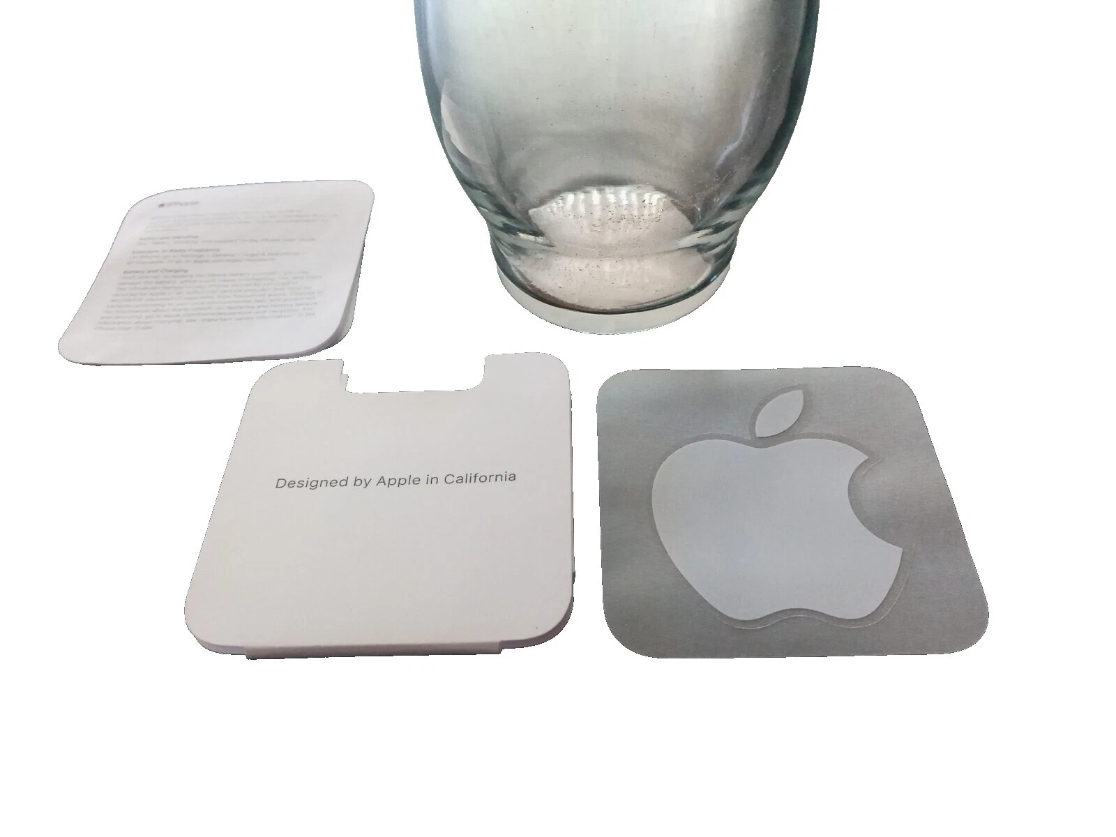 Teléfono celular blanco Apple y Adhesivos