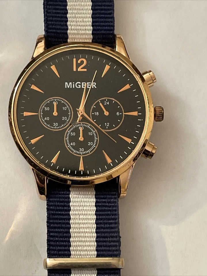 Reloj Migeer esfera negra redonda tono oro rosa caja azul blanco correa lona PERFECTO Foto 2 de 4