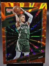 2021-22 Donruss Orange Laser Holo #94 Donte DiVincenzo - Milwaukee Bucks