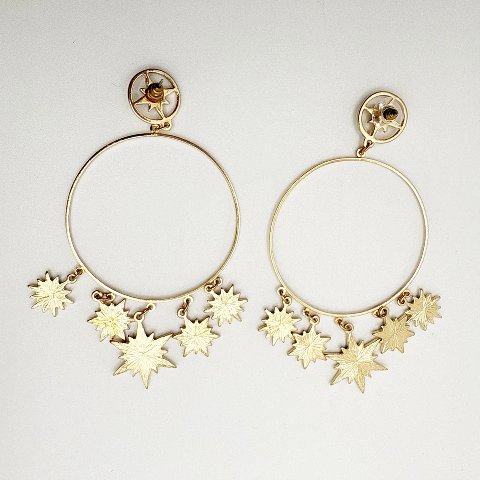 Pendientes de aro Thalia Sodi tono dorado estrella cristal declaración colgante celestial usados en excelente estado Foto 3 de 3