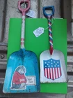 pair of vintage metal toy shovels from Ohio Art.