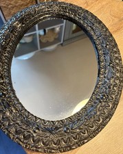 BLACK PLASTER PATTERNED OVAL MIRROR VELVET BACK 13.5 X 10.5 IN APPROXIMATELY