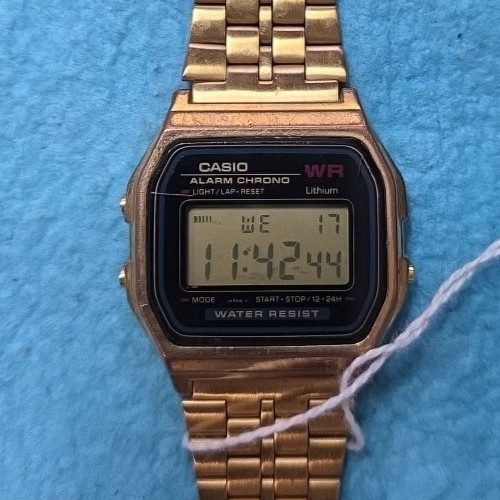 Vintage Casio Digital Gold Watch 593 A159WGE keeps time day date- water resist