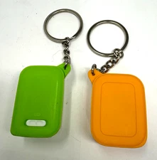 2-TUPPERWARE KEYCHAIN'S (7326A-GREEN)-(84074A- ORANGE) PILL KEEPER