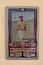 1983 PERMA GRAPHIC==GOLD==SUPER-STAR #-26 RICKEY HENDERSON==OAKLAND ATHLETICS