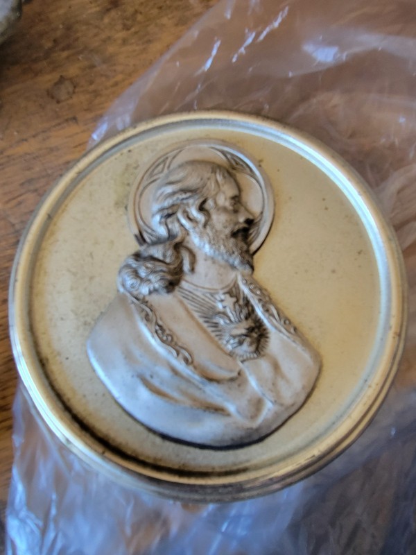 vintage religious medallion or plaque featuring a relief portrait of Jesus
