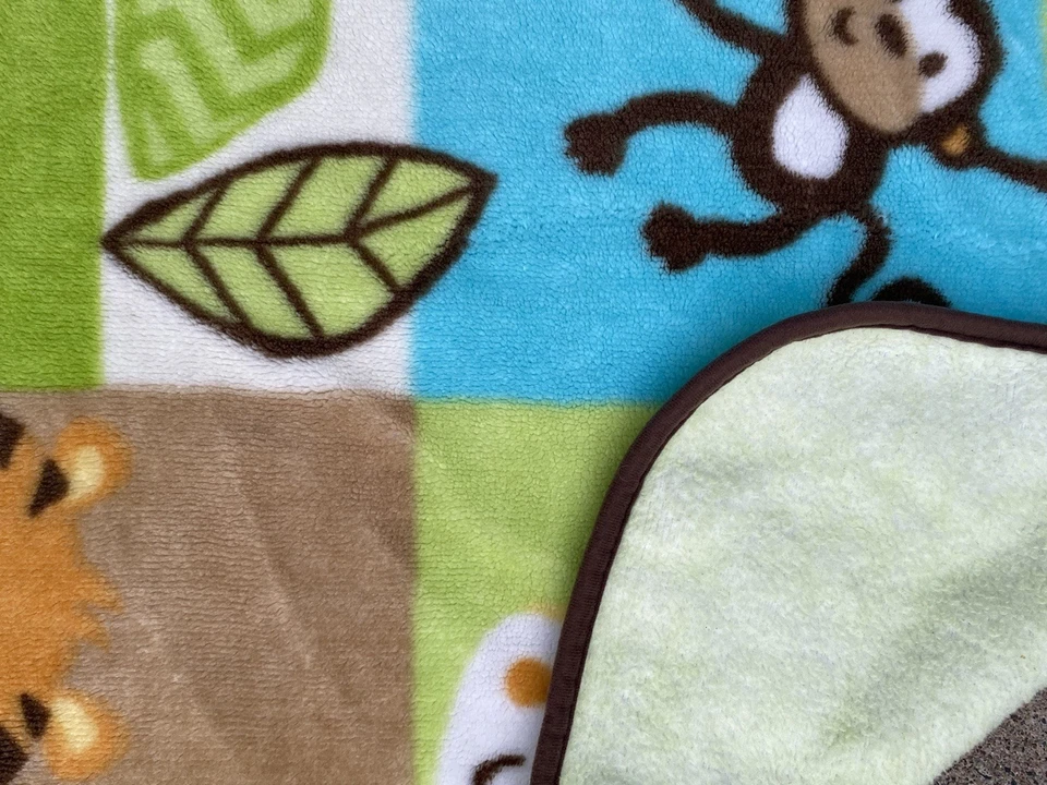 Manta bebé Garanimals azul verde tigre mono jirafa elefante pájaro 30x44 Foto 2 de 4