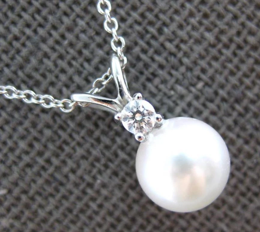 Solitaire floating pearl best sale necklace