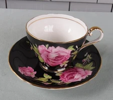 VINTAGE AYNSLEY BLACK CUP AND SAUCER WITH PINK CABBAGE ROSES