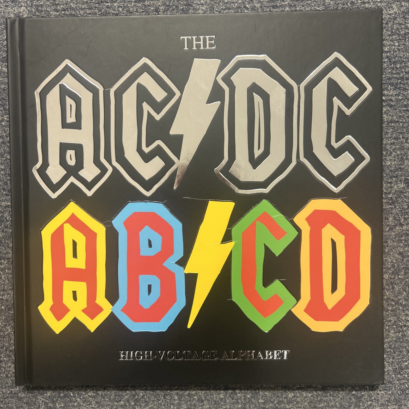 AC/DC AB/CD High Voltage Alphabet Kids Book BY Paul McNeil NEW HARDBACK