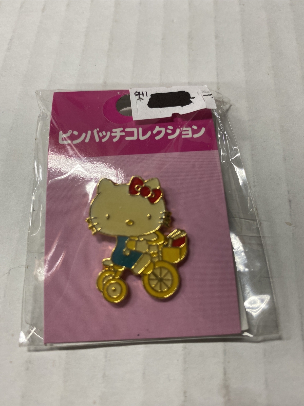 Tokyo Sanrio Hello Kitty Riding Yellow Bike W/ Books In Bask