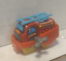 TIN WIND UP TOY JAPAN FIRE CHIEF red fire truck w/ blue ladder yellow wheels 188