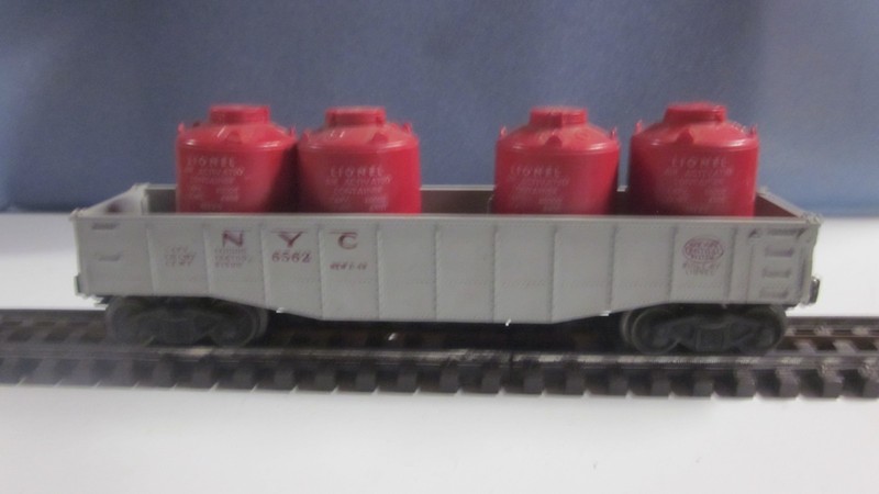 Lionel 6562 gray, NYC, gondola, red lettering w/4 red original canister load