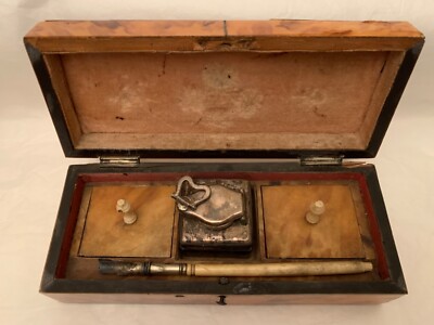 A small 19th century veneered writing box, the rectangular hinged lid enclosing