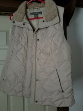 Women's winter vest. Size-large, color-beige in new condition, never used.