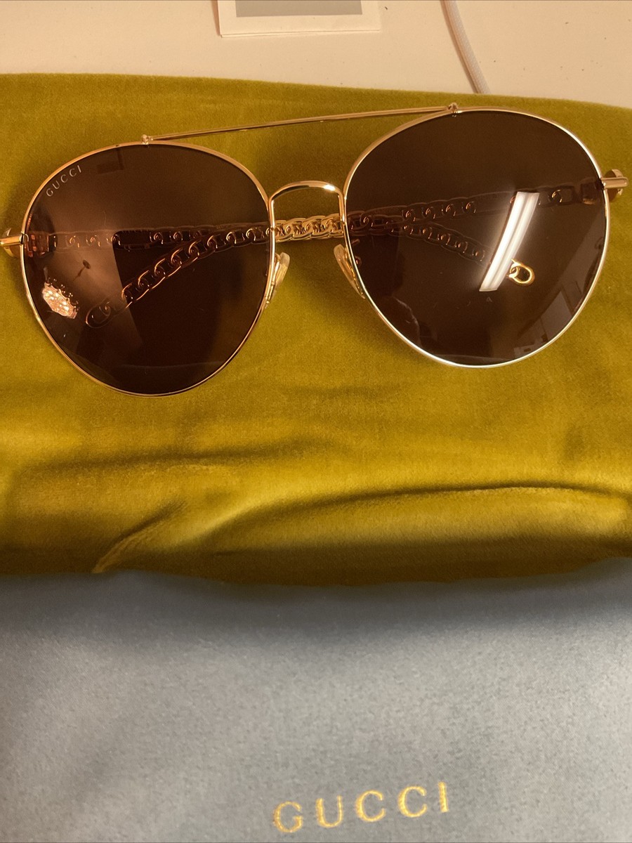 Gucci GG0725S-002 Gold Brow Bar Round Interlocking Logo