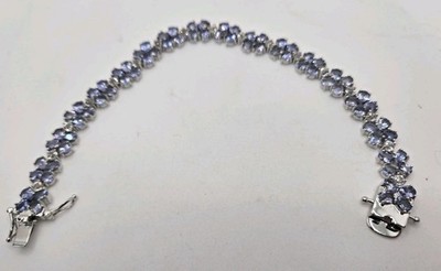 10,50 ctw ovaler tansanit mit 2,50 ctw rundem weisstopas rhodium über silber