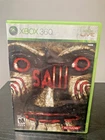 SAW Microsoft Xbox 360 Authentic Tested & Working Cover Art Water Damage
