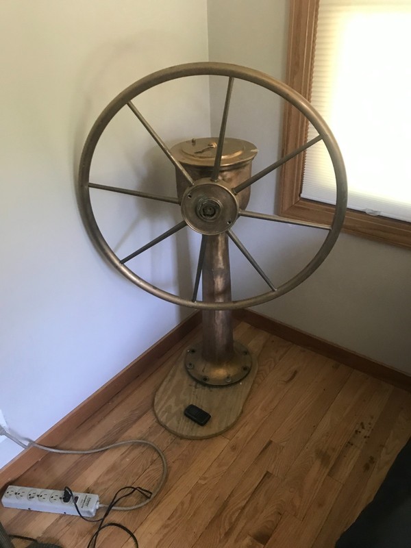 antique ships wheel with rudder indicatecater