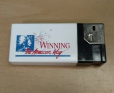 The American Tobacco Company White Lighter Winning The American Way