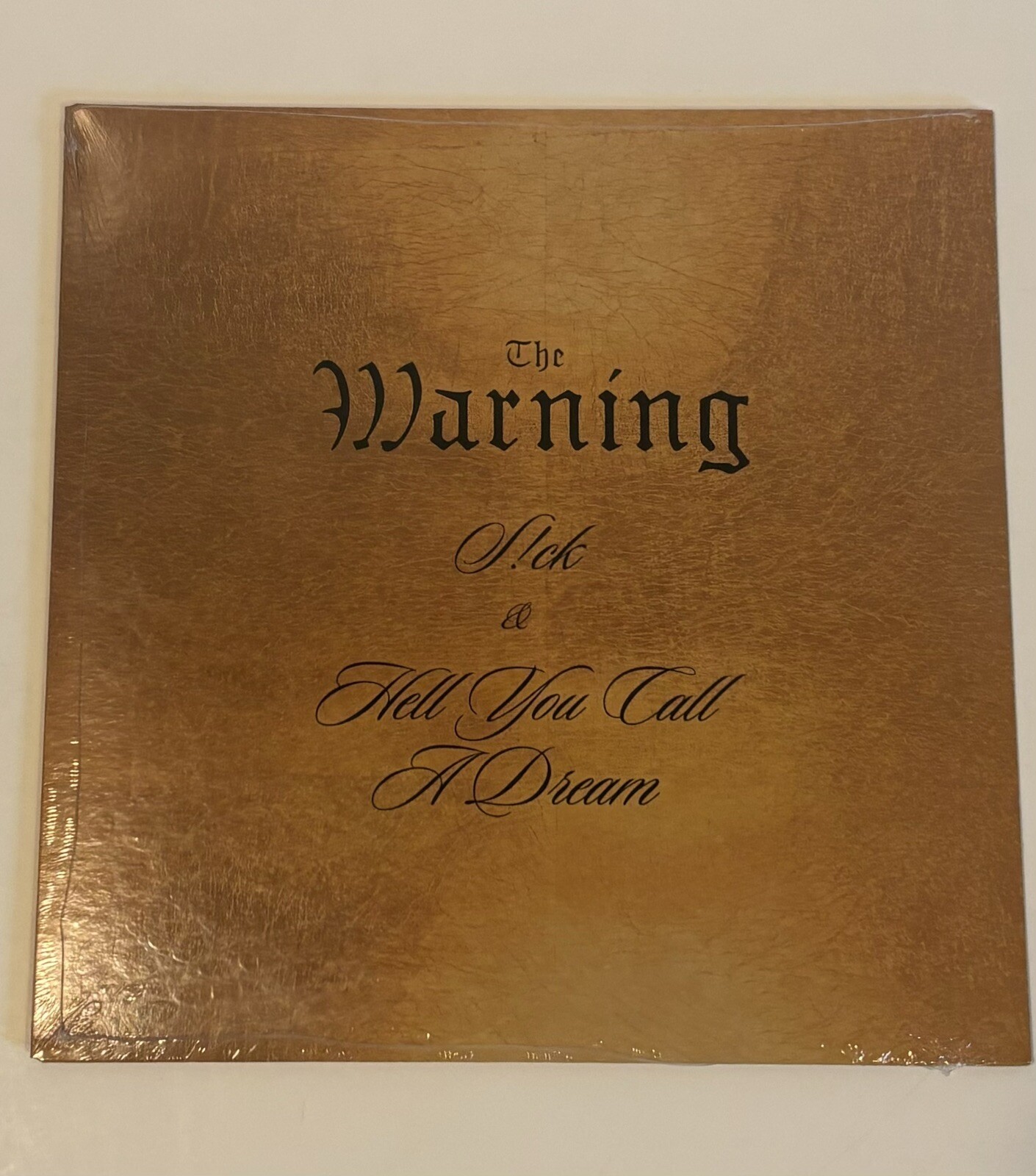 The Warning Band, S!CK/Hell You Call A Dream 7” GOLD VINYL RECORD.