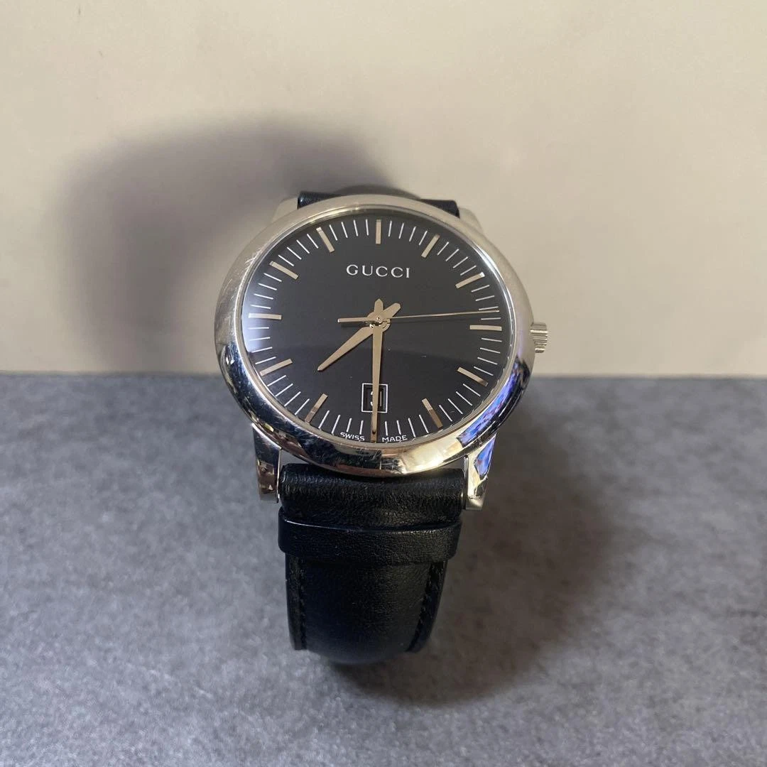 Rare montre Gucci bracelet cuir noir 5600M date