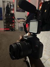 Canon EOS Rebel T100 Digital SLR Camera Black w/ Lens, Mic, LED Light, Strap