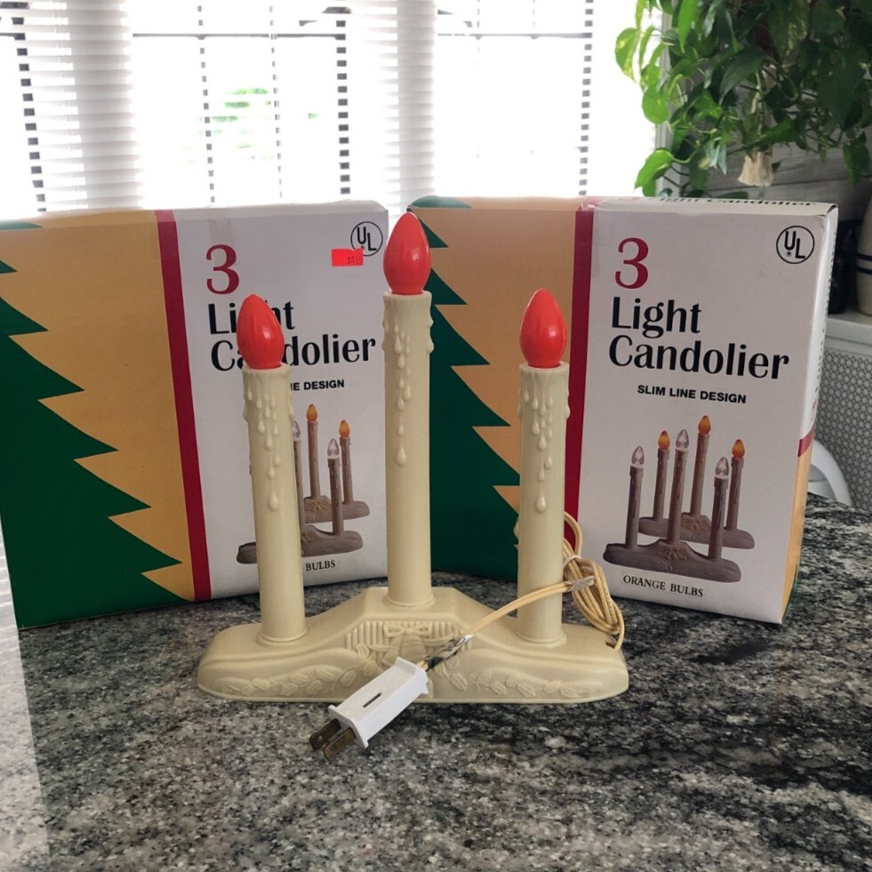 2 Vingage 3 Light Candolier Slim Line Design with Orange bulbs.