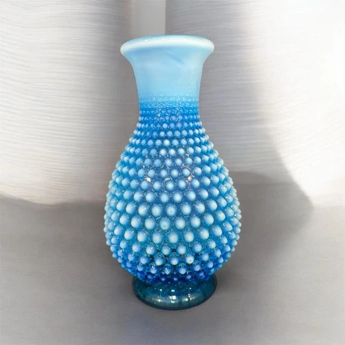 Glass vase in blue opalescent hobnail pattern by Fenton Art Glass