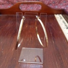 Large gold tone hoop earrings