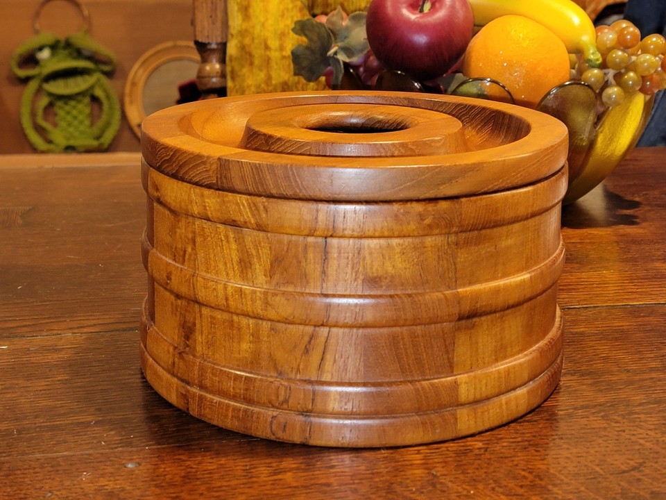 A Jens Quistgaard-designed Dansk teak ice bucket is a bona fide collectible — one of the most iconic MCM objects ever made.