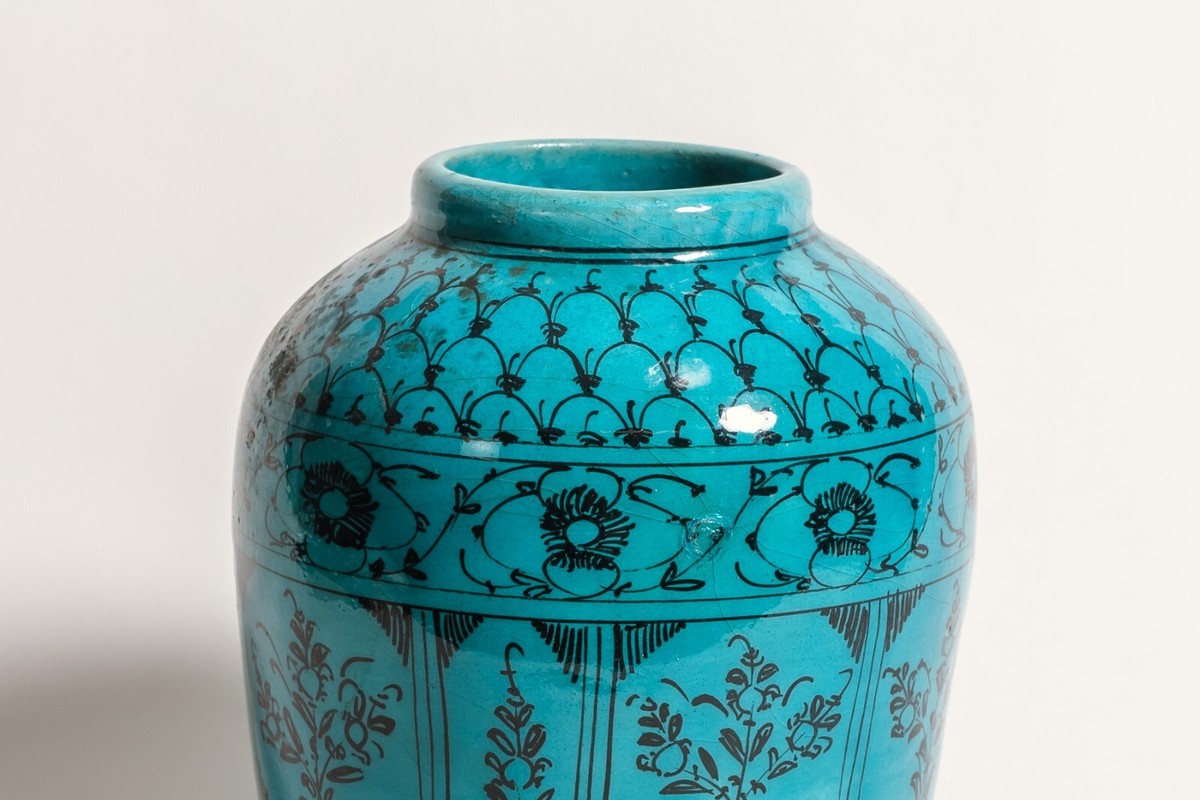 A Persian Turquoise Ceramic Vase with Fish Design, Circa
