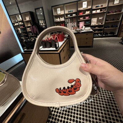 Coach Mini Ergo Bag In Coachtopia Leather With Caterpillar Print