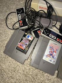 FOR PARTS  2 NES NINTENDO consoles + Cords controllers Games *Powers On* READ