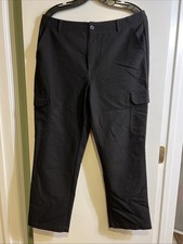 Women's black trousers with a zipper and extra pockets, size 10.