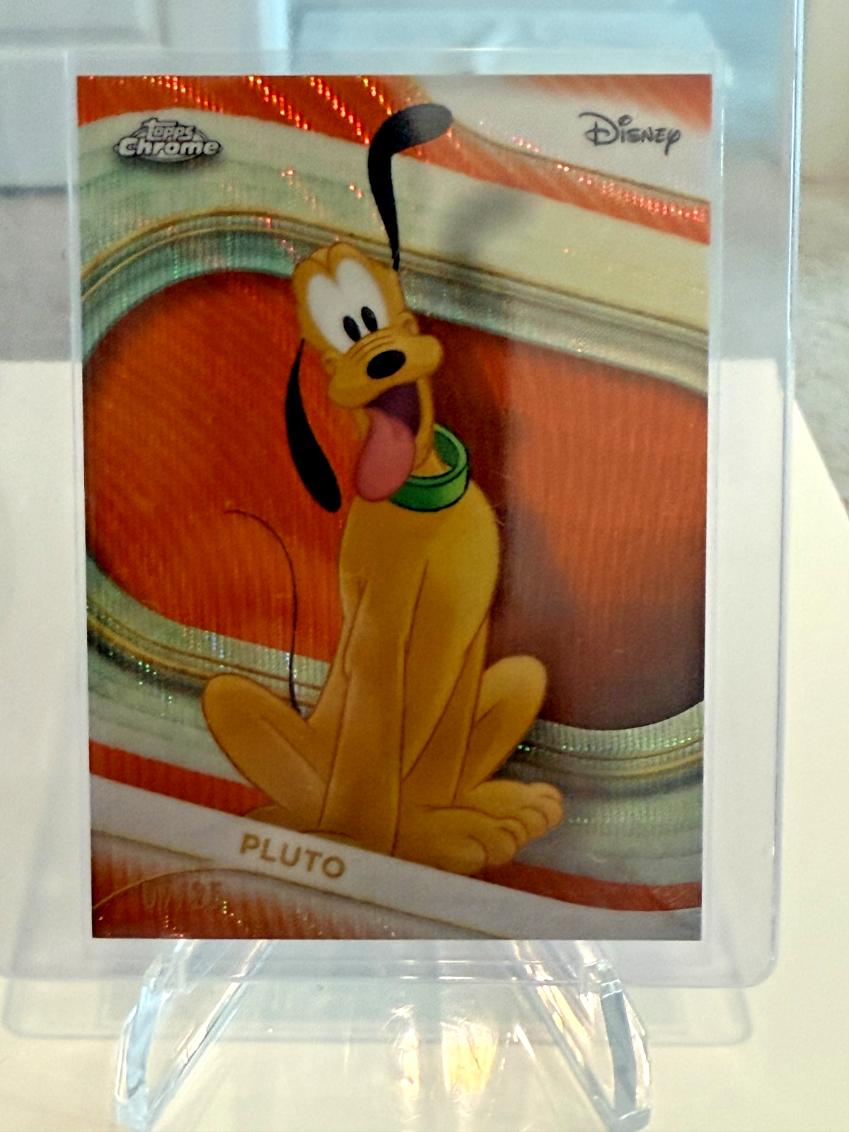 2025 Topps Chrome Disney Pluto /25 (#7) Orange Wave Refractor #95