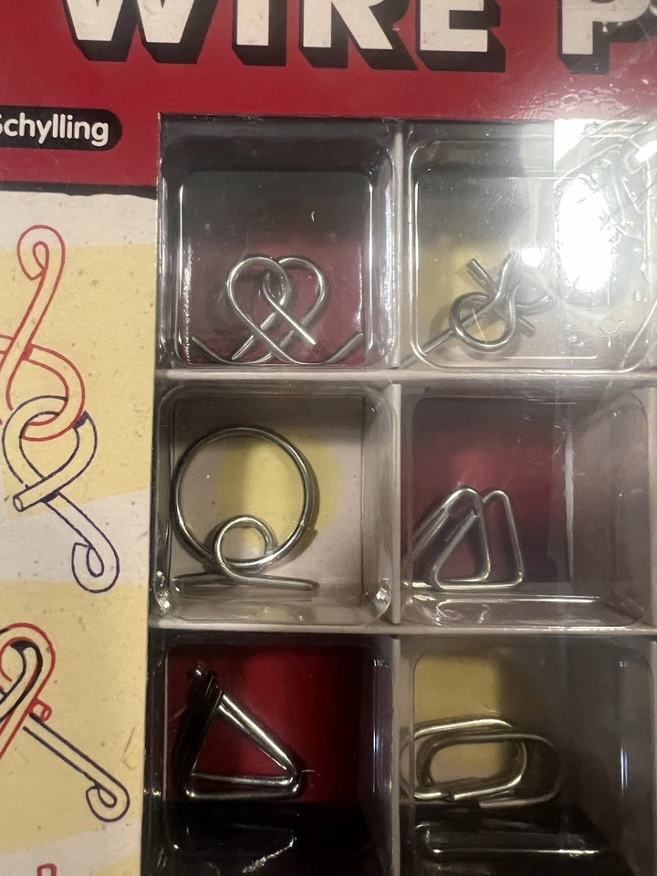 12 PUZZLES DE ALAMBRE Schylling rompecabezas juegos mentales juguete rompecabezas de alambre de acero Foto 2 de 4