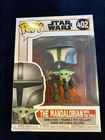 Funko Pop! Vinyl: Star Wars - The Mandalorian with the Child #402