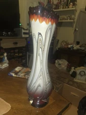 vintage Opaline Florence vase with a black and orange swirl design, Murano