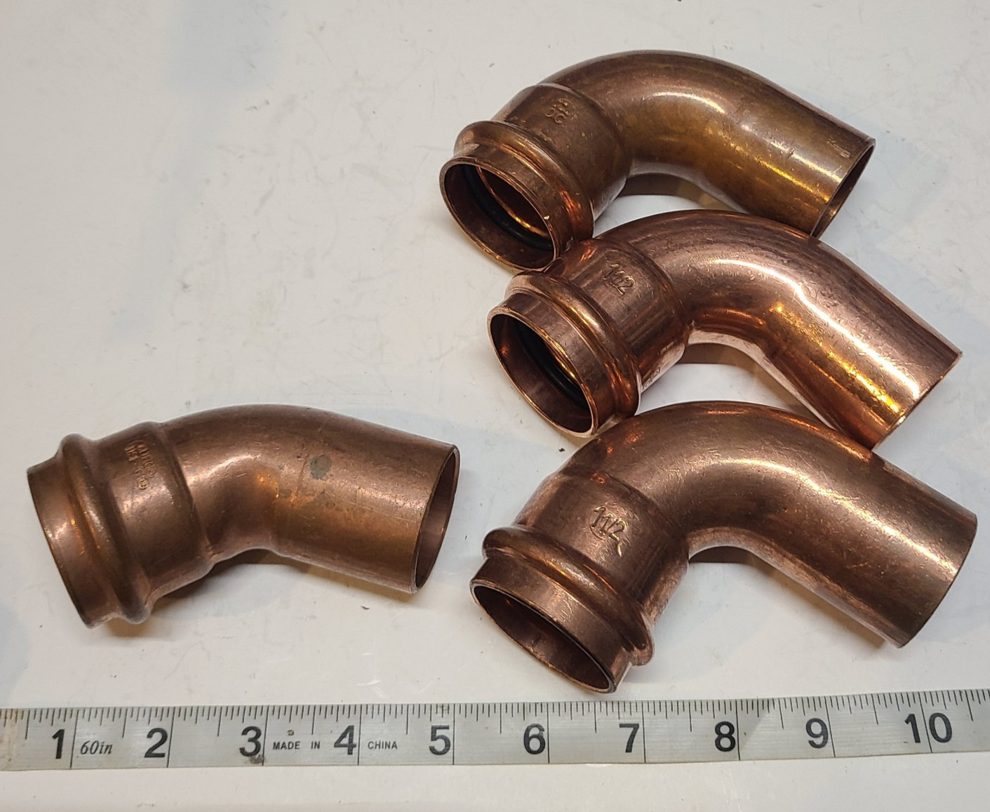 Lot of  ( 4)  1-1/2" Press x FTG Copper 90° & 45° Street Elbow's