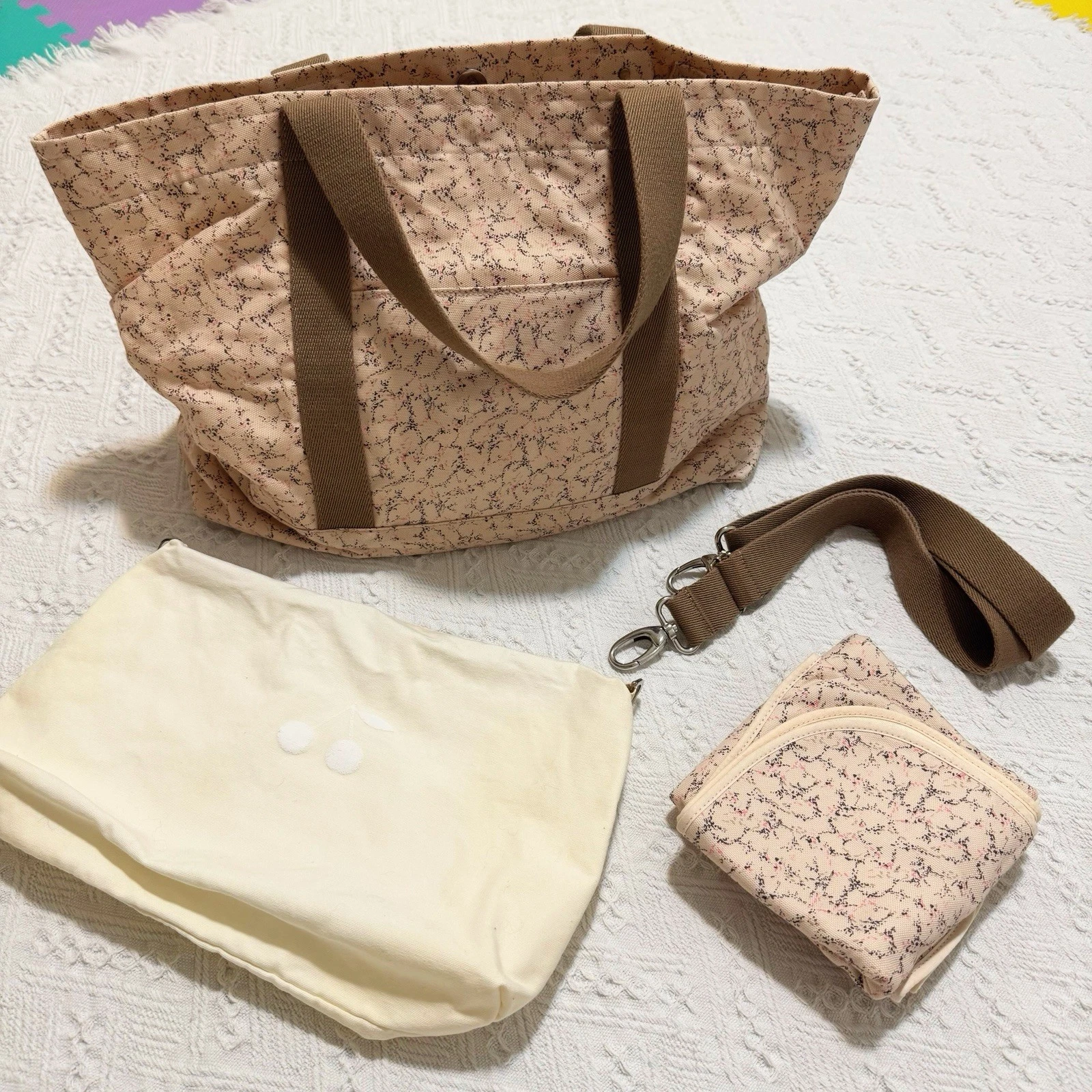 Bonpoint diaper bag with diaper changing pad and pouch