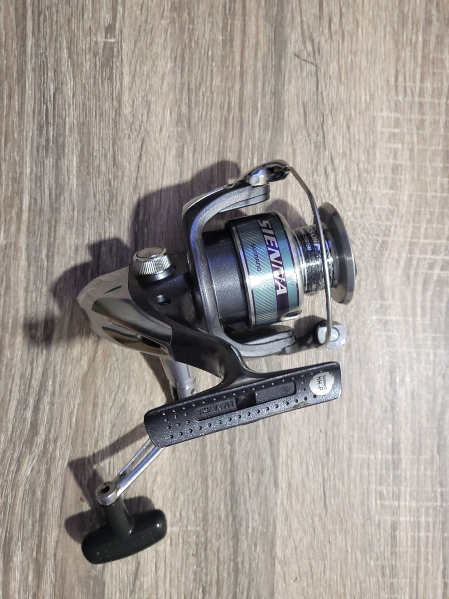 man holding shimano sienna 4000fd Shimano Sienna 4000FD Fishing Reel