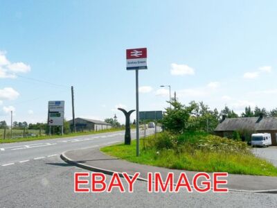 PHOTO  MILEPOST AND STATION SIGN GRETNA GREEN AT THE JUNCTION OF THE B7076 AND T