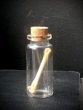 Jar of a Rabbit Leg Bone. Real Bone in a small cork Jar.