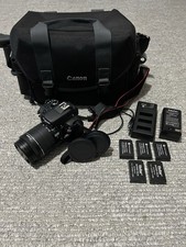Canon EOS Rebel SL1 Camera Bundle with Bag, Lens Caps, 5 Batteries, 2 Chargers
