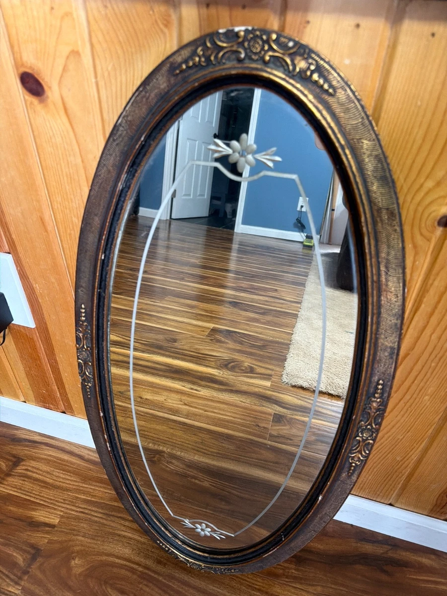 Antique etched oval mirror with decorative ornate on frame