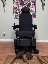 Power wheelchair with iLevel lift, tilts, reclines, elevates 