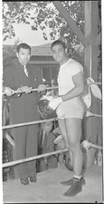 Joe Louis receives a good luck visit from Jack Dempsey former heav- Old Photo