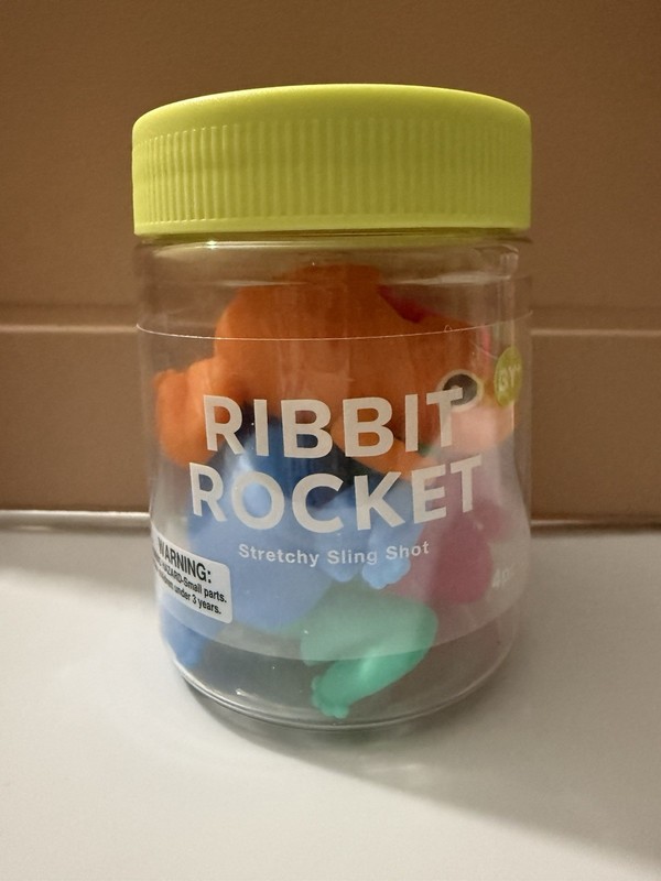 J'Adore Ribbit Rocket Stretchy Slingshot Band Toy