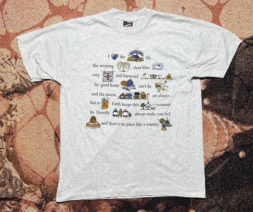 Gray VINTAGE tee with “Country Life” text, floral border, and USA map graphic with red and blue country names.